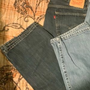 Three pair of men’s jeans .
